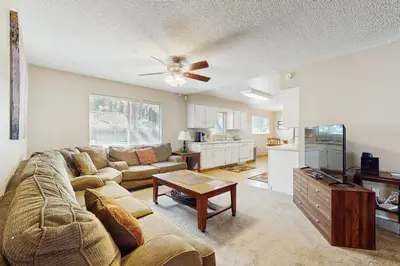 a living room with a couch and a tv at Glenwood Getaway in South Lake Tahoe