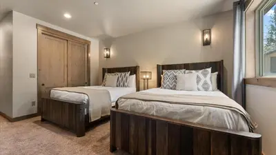 a bedroom with two beds and a window at South Lake Escape Indoor Pool plus Movie Theater in South Lake Tahoe
