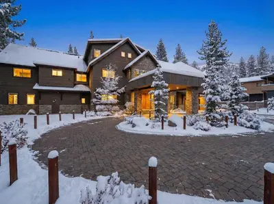 a home in the winter with snow on the ground at South Lake Escape Indoor Pool plus Movie Theater in South Lake Tahoe