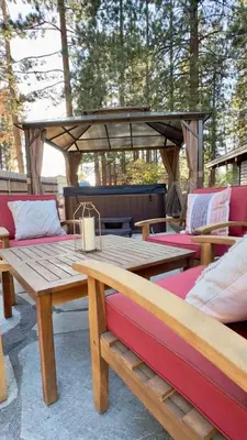 a wooden table and benches on a patio at Pine Ridge Retreat in Stateline