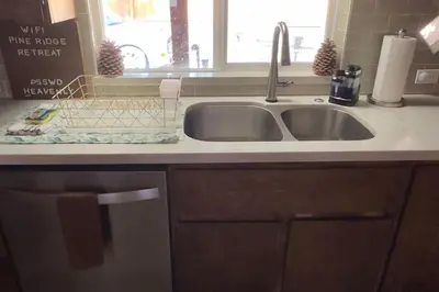 a kitchen counter with a sink and a window at Pine Ridge Retreat in Stateline