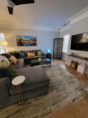 a living room with a couch and a table at Terrace On Main Street in Murphys