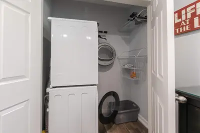 a kitchen with a white refrigerator in a room at Private Woods - Cottage for 4 in South Lake Tahoe