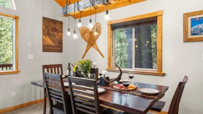 a dining room with a table and chairs at Outdoor Dining Backyard Trails Nearby Cedar Hollow Retreat by AvantStay in Tahoma