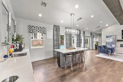 a kitchen and living room with a table and chairs at Luxury King Suite by the Lake - Entire Place in Sparks