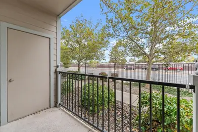 a house with a white door and a fence at Luxury King Suite by the Lake - Entire Place in Sparks