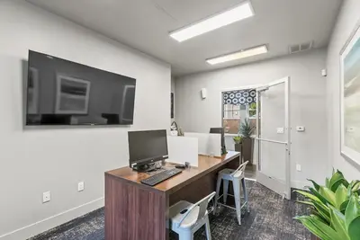an office with a desk with a computer on it at Luxury King Suite by the Lake - Entire Place in Sparks