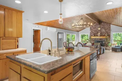 a kitchen with a sink and a counter top at WoodUStau in Coarsegold