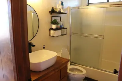 a bathroom with a sink and a toilet and a shower at Lakeview Yosemite 3B2b Private House - Panoramic Sauna - Seasonal Hot Tub Jacuzzi in Groveland