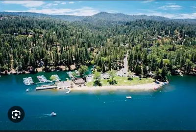 an aerial view of an island in the middle of a lake at Lakeview Yosemite 3B2b Private House - Panoramic Sauna - Seasonal Hot Tub Jacuzzi in Groveland