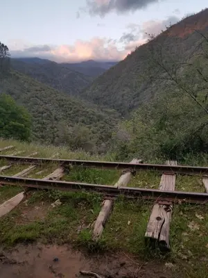 a set of train tracks with a view of a mountain at Cozy Mountain Cabin Yosemite Dodge Ridge Ski in Tuolumne