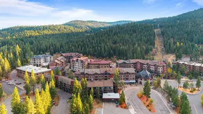 an aerial view of a resort in the mountains at Cozy Northstar Village Escape w Forest Views Easy Lift Access Alpineglow Vista by AvantStay in Truckee
