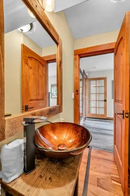 a bathroom with a large wooden bowl sink on a counter at Kings Beach Retreat Hot Tub & Game Loft in Kings Beach