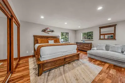 a bedroom with two beds and a couch in it at Kings Beach Retreat Hot Tub & Game Loft in Kings Beach