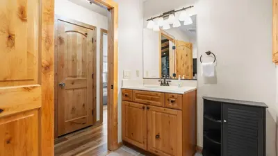 a bathroom with a sink and a mirror at Steps to Trails Minutes to Heavenly Fireplace Deck BBQ Bluewood Cabin by AvantStay in South Lake Tahoe