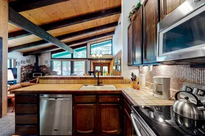 a kitchen with a sink and a counter top at Chateau Sans Nom 11 in Mammoth Lakes