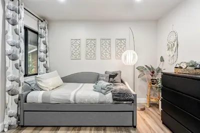 a bedroom with a bed and a dresser at CYH0883- Patricia's Mountain Paradise home in South Lake Tahoe