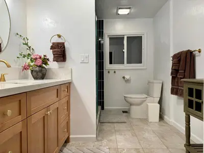 a bathroom with a sink and a toilet in it at Relax Under the Stars, Best view in town , Yosemite House with Firepit, Hot Tub, Game Room & Pool table in Oakhurst