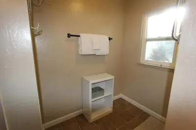 a bathroom with a towel rack and a window at HCH0864 - Donner Cabin home in South Lake Tahoe