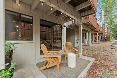 two chairs and a table outside of a house at Charming Tahoe Cabin in Incline Village