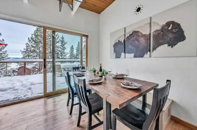 a dining room with a wooden table and chairs at Peaceful Forest Retreat Near Lake and Town in Tahoe City