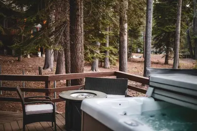 a grill and a table and chairs on a deck at Iroquois Ridge Hot Tub Near Lake Tahoe & Skiing in South Lake Tahoe
