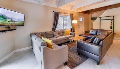 a living room with two couches and a flat screen tv at Iroquois Ridge Hot Tub Near Lake Tahoe & Skiing in South Lake Tahoe