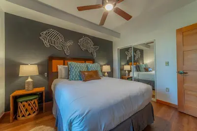 a bedroom with a bed and a ceiling fan at Posh Village 2/2; Ski-In/Out + Premiere Perks! in Mammoth Lakes
