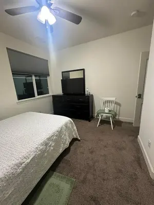 a bedroom with a bed and a flat screen tv at Peaceful Private Room near Sparks in Sparks