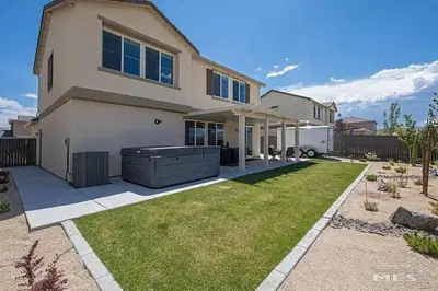 a large house with a lawn in front of it at Peaceful Private Room near Sparks in Sparks