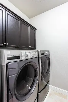 a laundry room with a washer and dryer at Nic's Home in Visalia