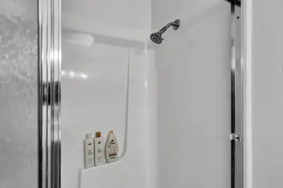a shower in a bathroom with the door open at Wooded Getaway Steam Shower plus Hot Tub in Tahoe City
