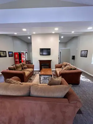 a large living room with couches and a table at Cozy Walk-to-Lifts Mammoth Condo with Hot Tub in Mammoth Lakes