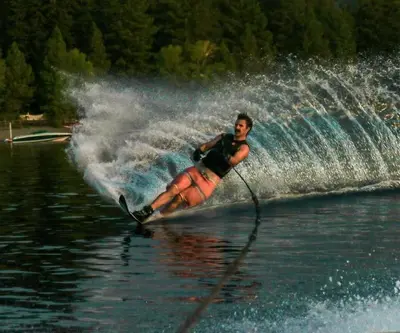 a man is water skiing on a lake at Dollar Point for 10-Hot Tub-One Block to the Beach-Filtered Lake Views-Quiet Neighborhood in Tahoe City