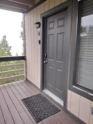 a gray door on a house with a porch at Galaxy Way Close to Stagecoach Chair in Stateline