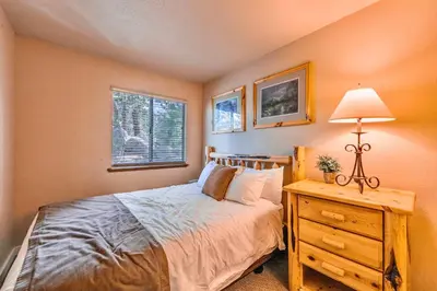 a bedroom with a bed and a table with a lamp at Galaxy Way Close to Stagecoach Chair in Stateline