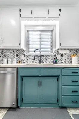 a kitchen with blue cabinets and a sink at OctaFarmRetreat - Gateway To Sequoia Natl Park in Visalia