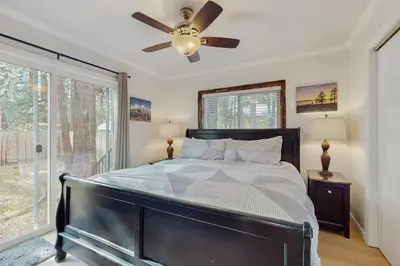 a bedroom with a bed and a ceiling fan at The Regan Beach Vista in South Lake Tahoe