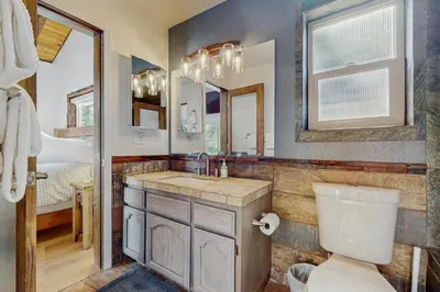 a bathroom with a toilet and a sink at The Regan Beach Vista in South Lake Tahoe