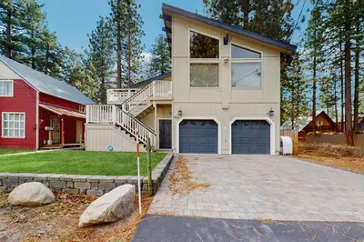 a house with two garage doors and a red house at The Regan Beach Vista in South Lake Tahoe