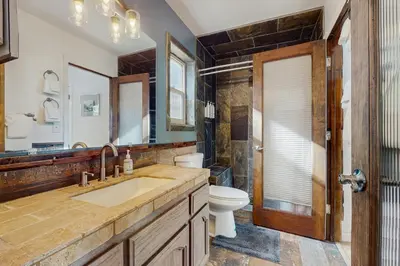 a bathroom with a sink and a toilet at The Regan Beach Vista in South Lake Tahoe