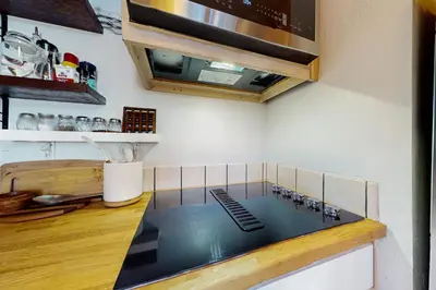 a kitchen with a stove top in a kitchen at Dog-Friendly Retreat with Lake Views in Kings Beach in Kings Beach