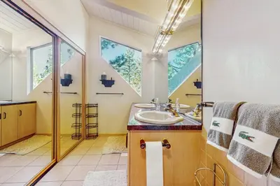a bathroom with a sink and a mirror at Dog-Friendly Retreat with Lake Views in Kings Beach in Kings Beach
