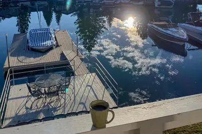 a table and chair on a dock in the water at Waterfront Bliss in South Lake Tahoe