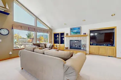 a living room with two couches and a tv at Waterfront Bliss in South Lake Tahoe