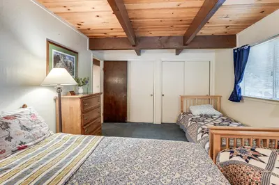a bedroom with two beds and a wooden ceiling at 4 Mi to State Park Quiet Escape with Deck in Arnold in Arnold