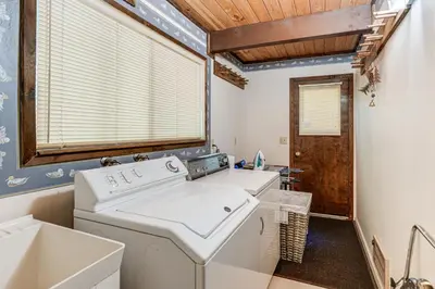 a laundry room with a washer and dryer at 4 Mi to State Park Quiet Escape with Deck in Arnold in Arnold