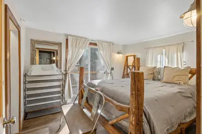 a bedroom with a large bed and a window at HCH0648 - Larchwood Lodge home in South Lake Tahoe