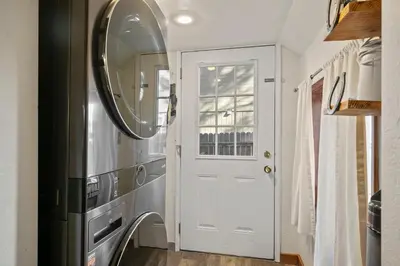 a hallway with a white door and a mirror at HCH0648 - Larchwood Lodge home in South Lake Tahoe