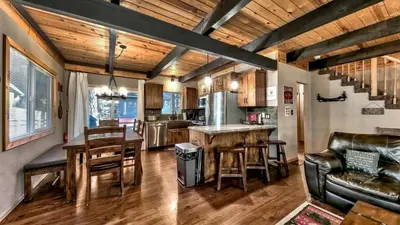 a kitchen and living room with a table and chairs at COH0809 - Brule Haven home in South Lake Tahoe